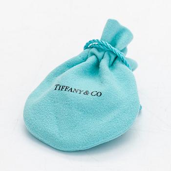 Tiffany & Co, Elsa Peretti, an 18K gold bracelet with a brilliant cut diamond ca 0.07 ct.