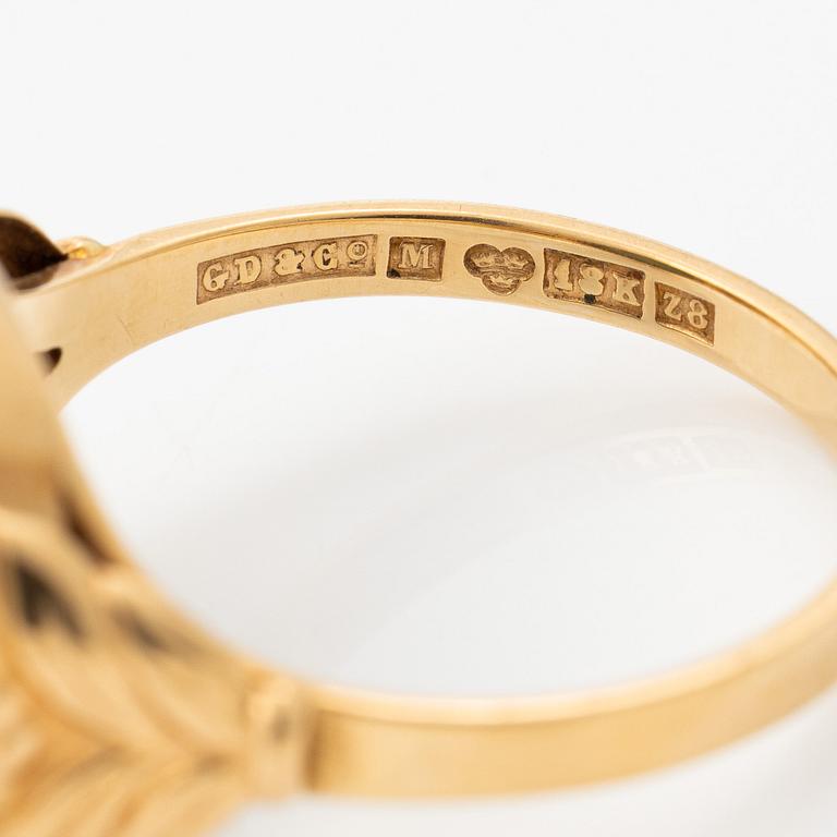 18K gold ring with green stone.
