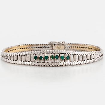 Bracelet with emeralds.