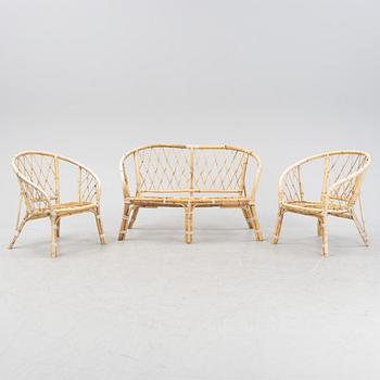 A rattan and bamboo sofa and two armchairs, second half of the 20th Century.