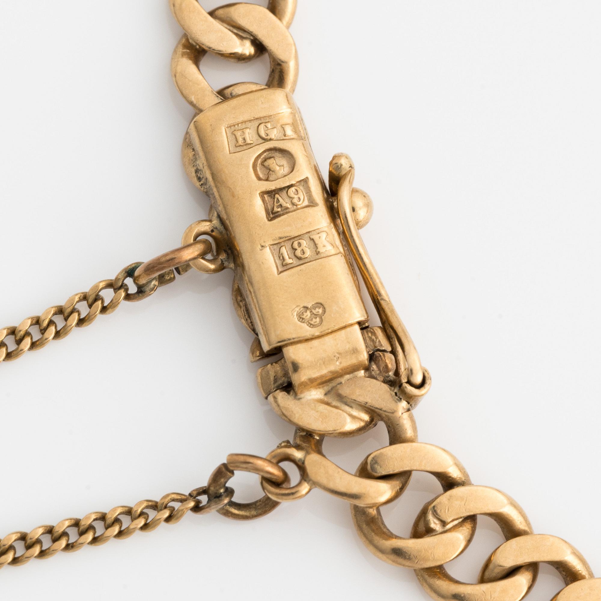 Armband 18k guld med berlocker.