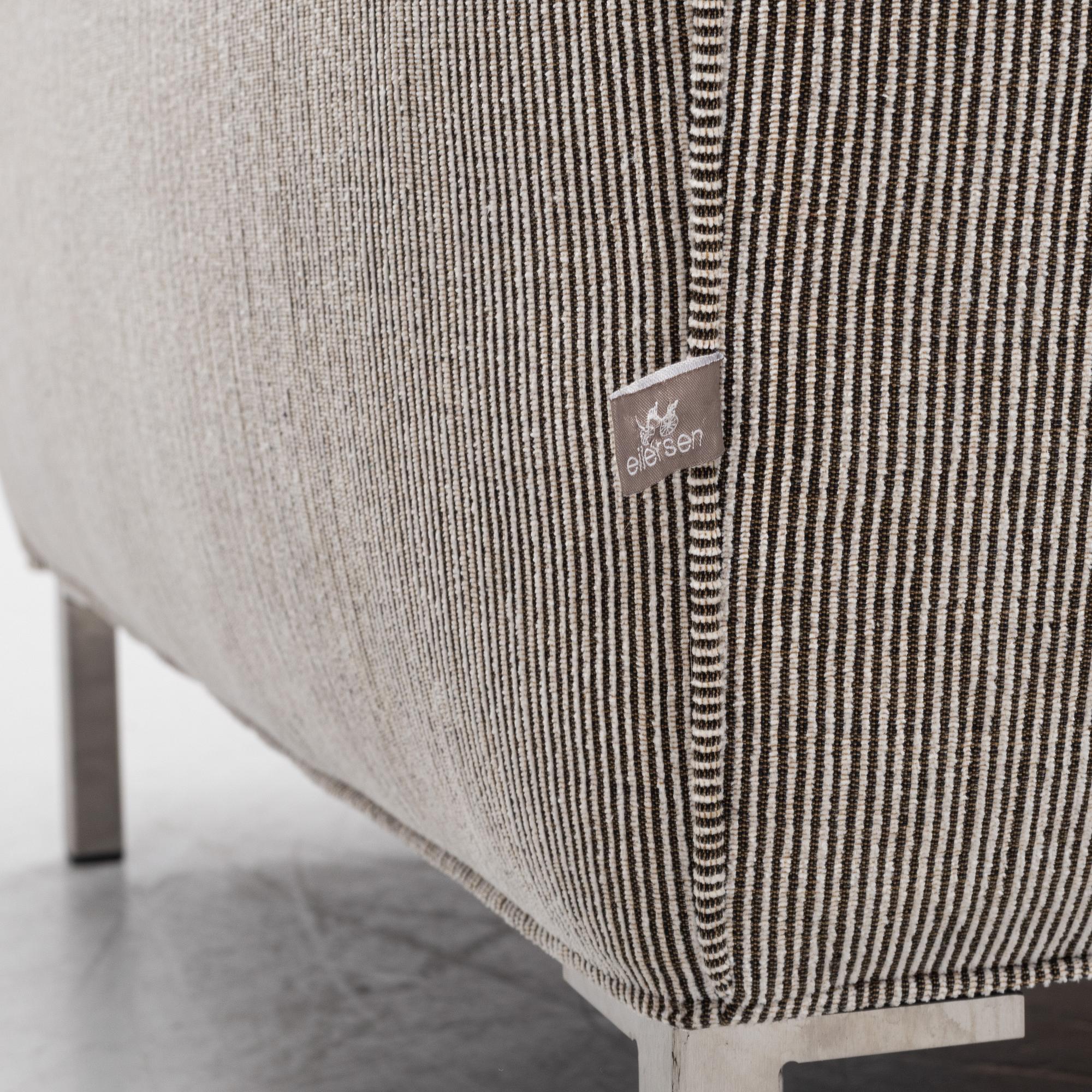 A 'Streamline' armchair with a foot stool, Eilersen.