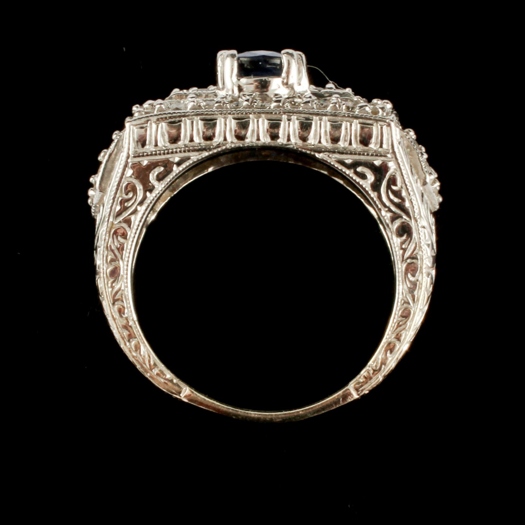 RING, 14k vitguld med små briljantslipade diamanter samt fasettslipad blå safir, utländska stämplar. Vikt 8 g.