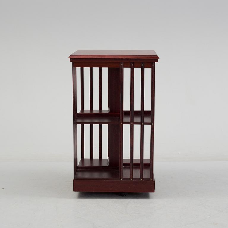 An second half of the 20th century turning book shelf veneered with mahogny.