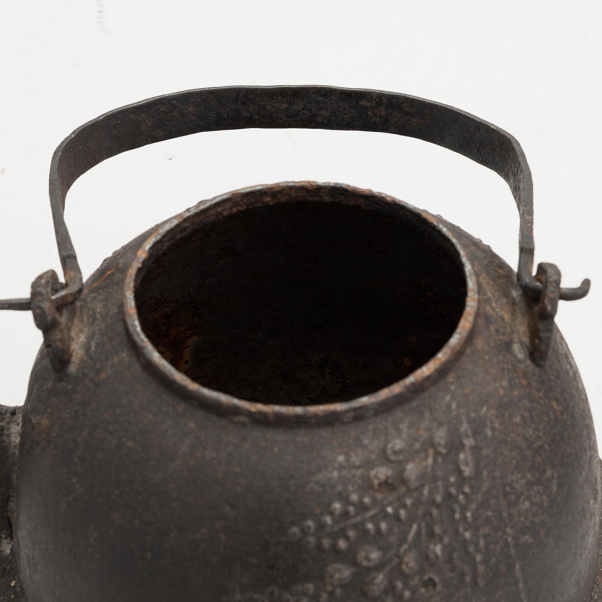 Two teapots and a hibachi brazier, Japan, early/ first half of the 20th century.