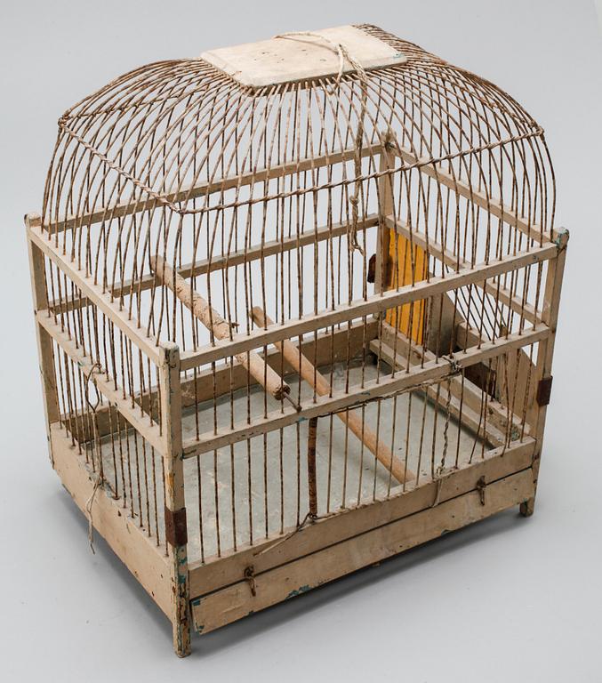 A bird cage from around the year of 1900.