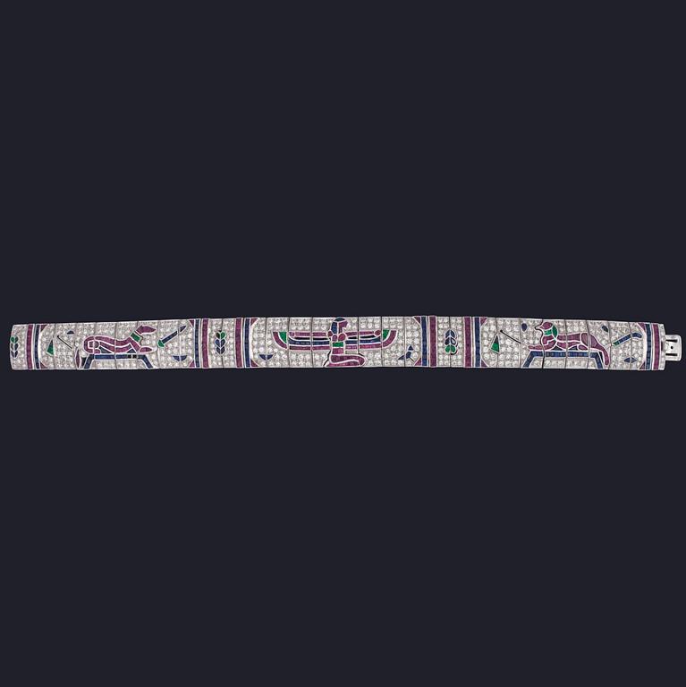 ARMBAND, carréslipade rubiner, safirer, smaragder samt briljantslipade diamanter, tot. ca 5 ct, egyptiskt motiv.