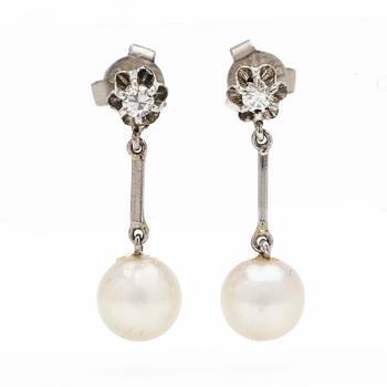 18K white gold earrings with cultured pearls and diamonds.