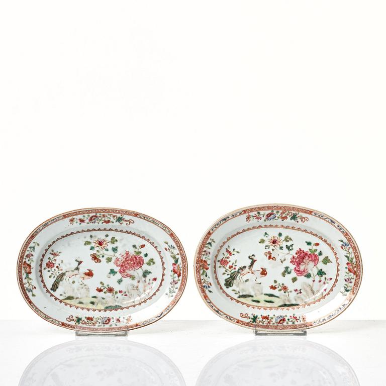 Two famille rose 'double peacock' butter tureens with covers and stands, Qing dynasty, Qianlong (1736-95).