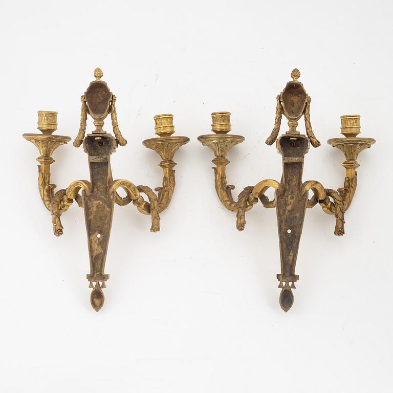 A pair of Louis XVI style two light wall-lights.