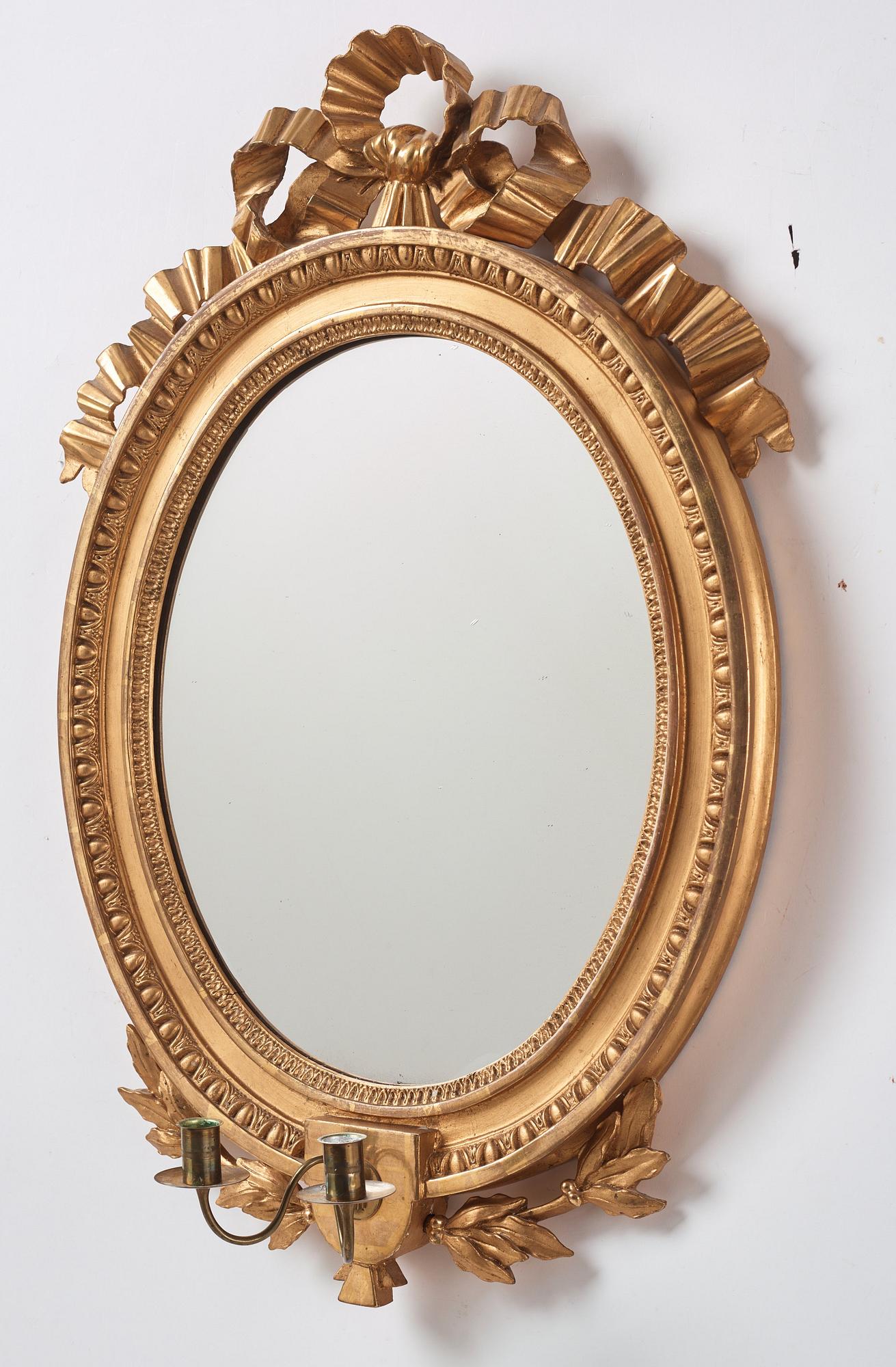A Gustavian two light girandole mirror. (later copy will follow the lot).
