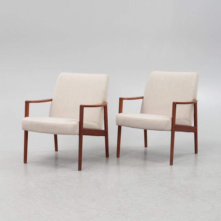 A pair of mid-century easy chairs.