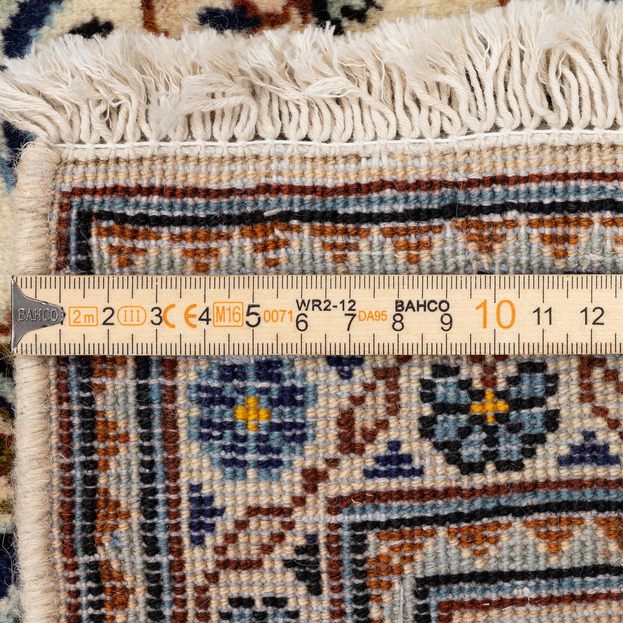 A Keshan carpet, c. 295 x 195 cm.