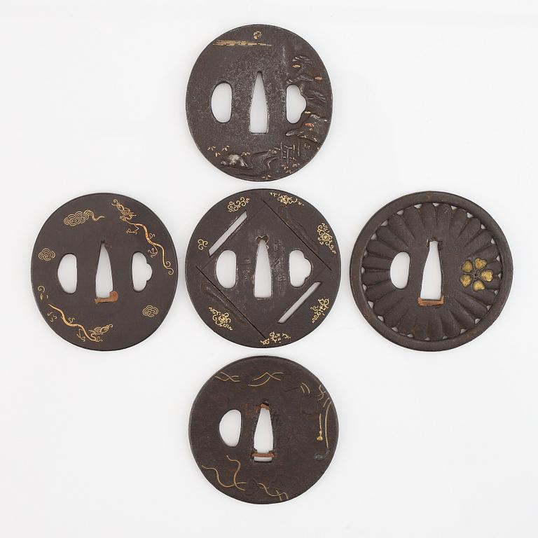 Five iron tsubas, one signed, Edo period.