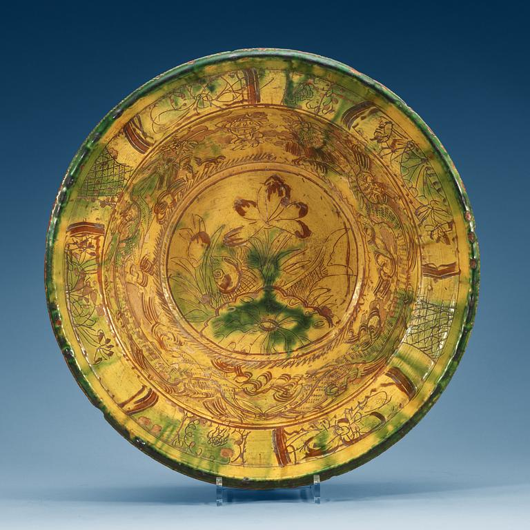 A large green and yellow glazed dish, 18th Century.