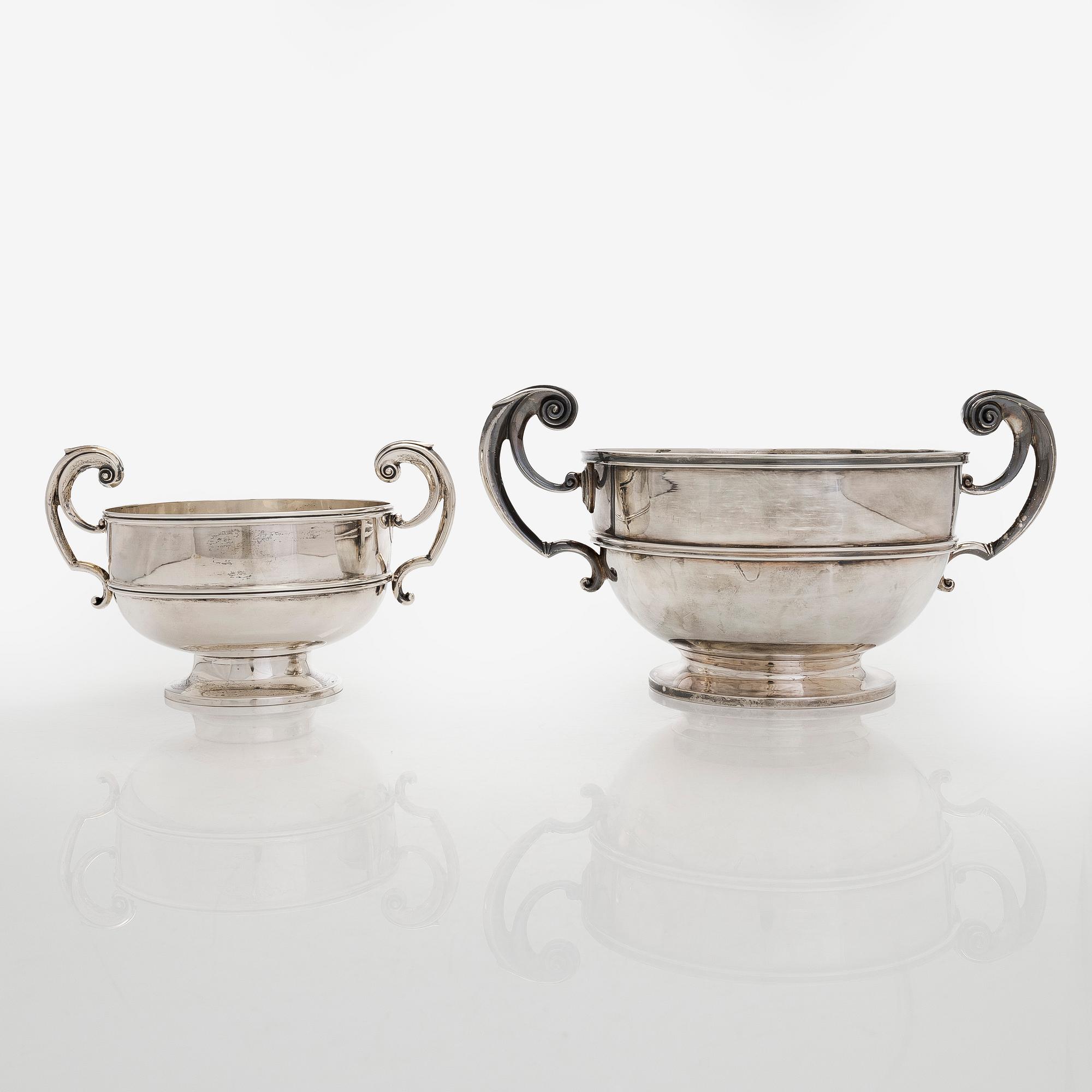 A set of two bowls with handles, sterling silver, England.