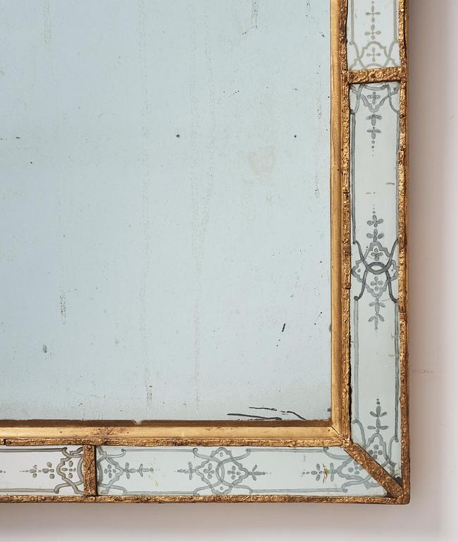 A Baroque gilt-lead and engraved glass mirror in the manner of Burchard Precht, early 18th century.