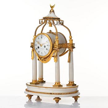 A Louis XVI mantel clock.