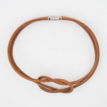 Hermès, a 'Atamé' leather knot necklace.