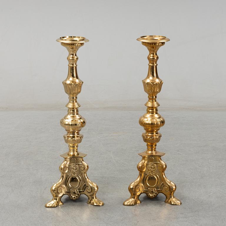A pair of late 20th century or early 21th century brass altar candlesticks.
