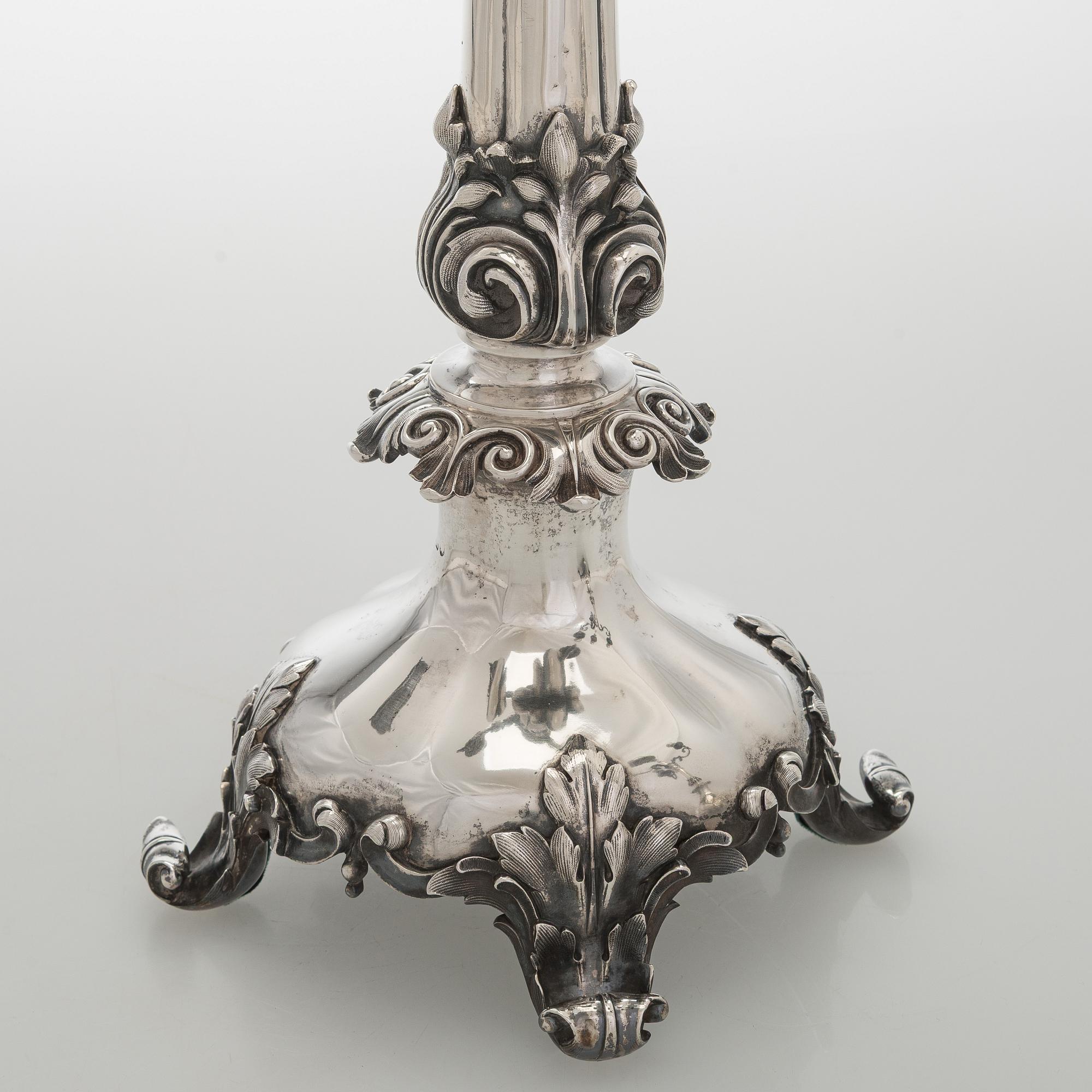 A pair of silver candelabra, maker marks of Carl Johan Tegelsten, Saint Petersburg 1850.