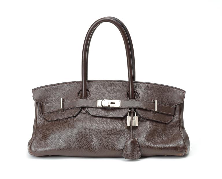 A handbag "JPG Shoulder Birkin 42 Taurillon Clémence" by Hermès.
