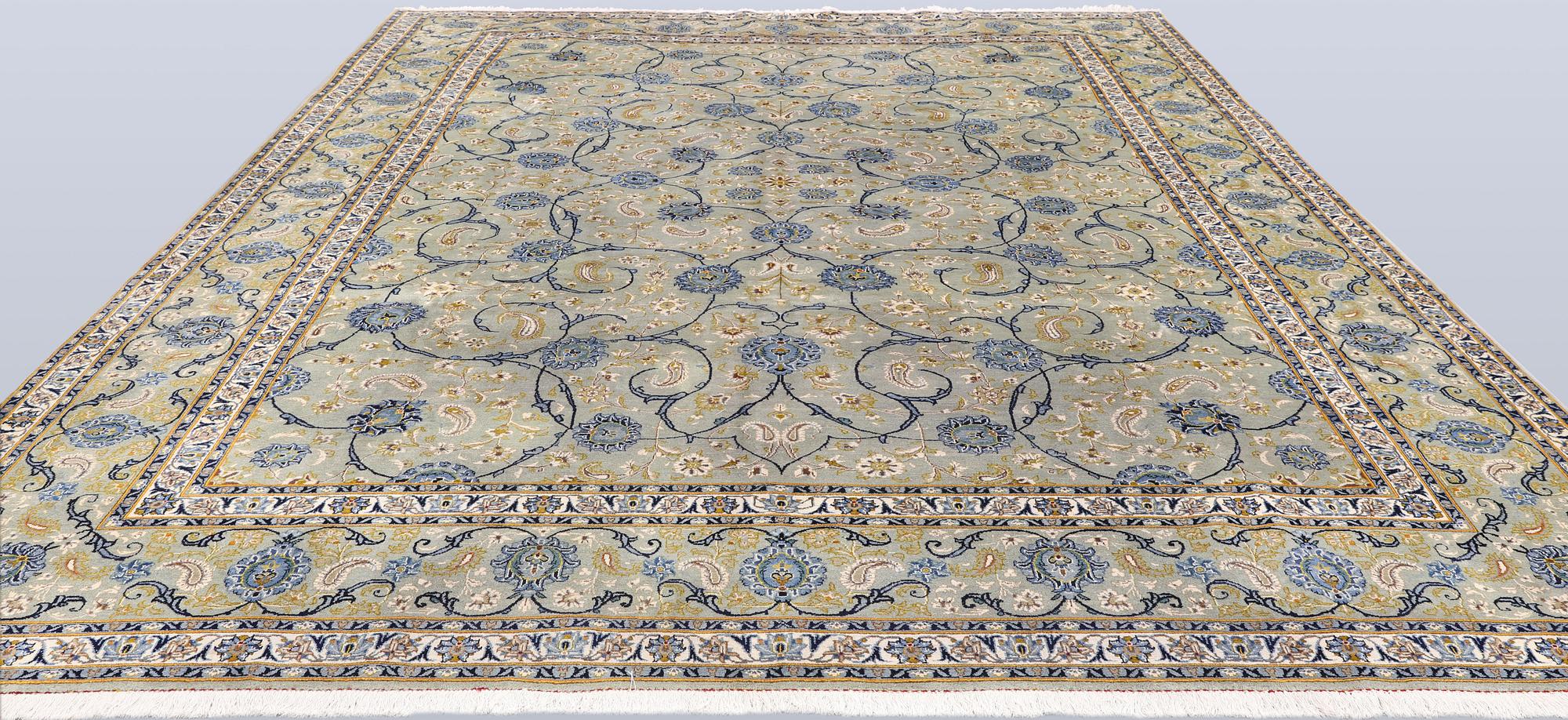 A Royal Keshan carpet, signed, 410 x 307 cm.