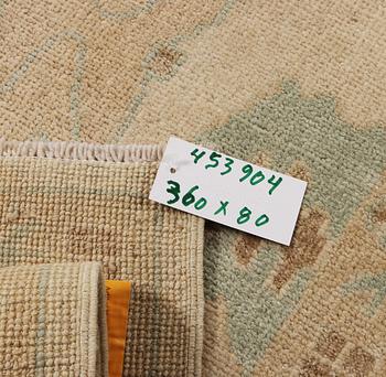 An Ushak runner carpet, c. 360 x 80 cm.