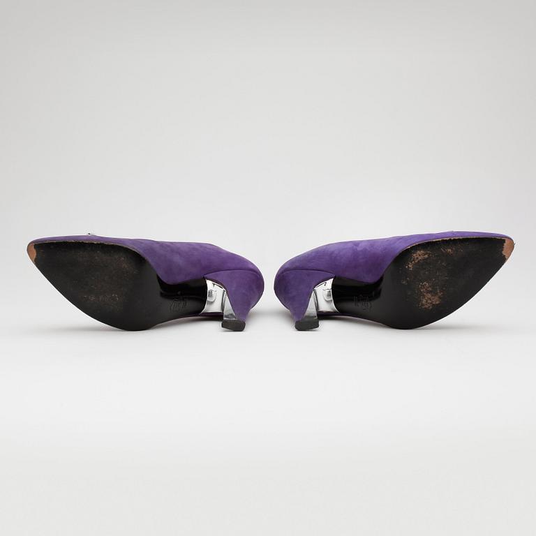 CHARLES JOURDAN, a pair of purple leather pumps.