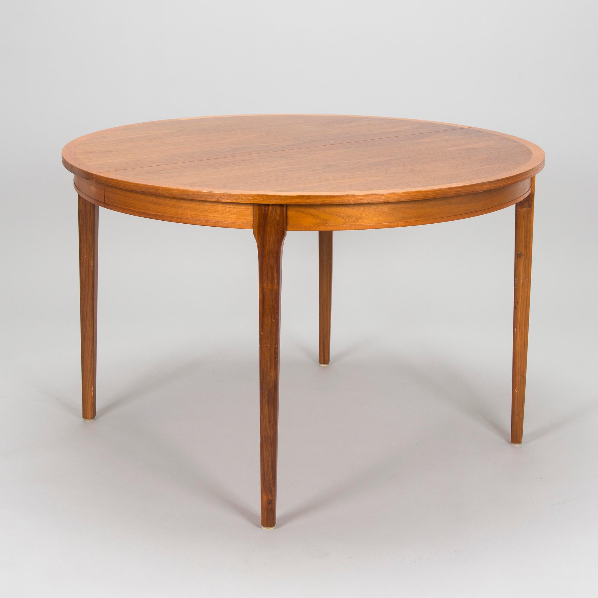 A 1960s teak and oak dining table.