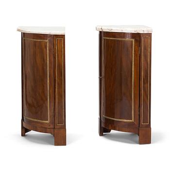 A pair of French Directoire corner cabinets from late 18th century.