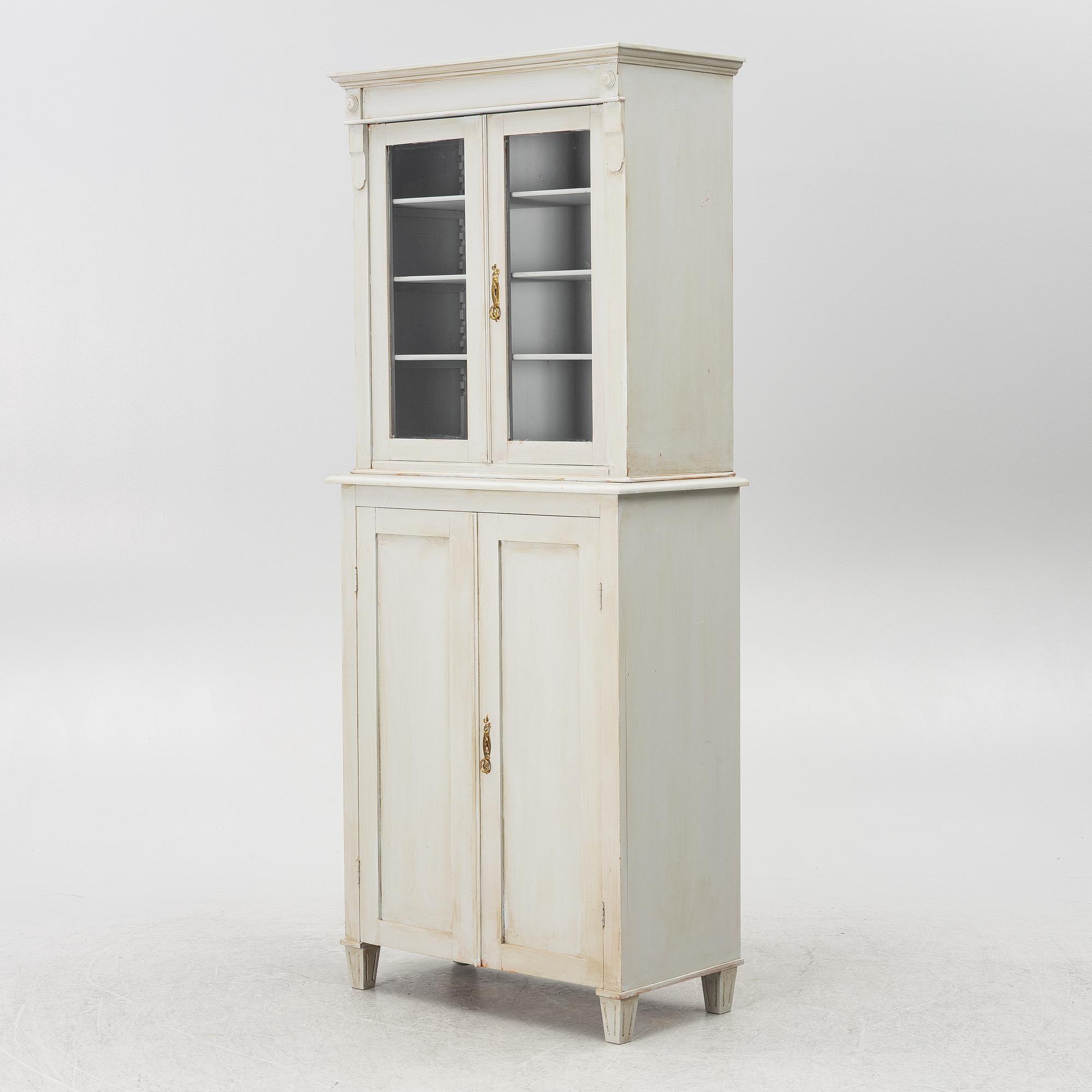 A display cabinet, early 20th century.