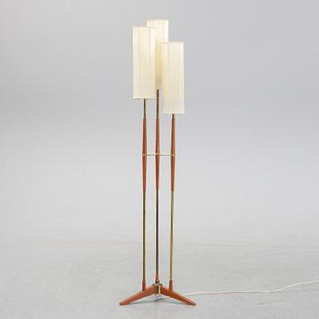 A wood and brass floor lamp from  Möllers Armaturer, Eskilstuna, mid 20th century.