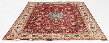 A carpet, Tabriz old, signed, approximately 294 x 208 cm.