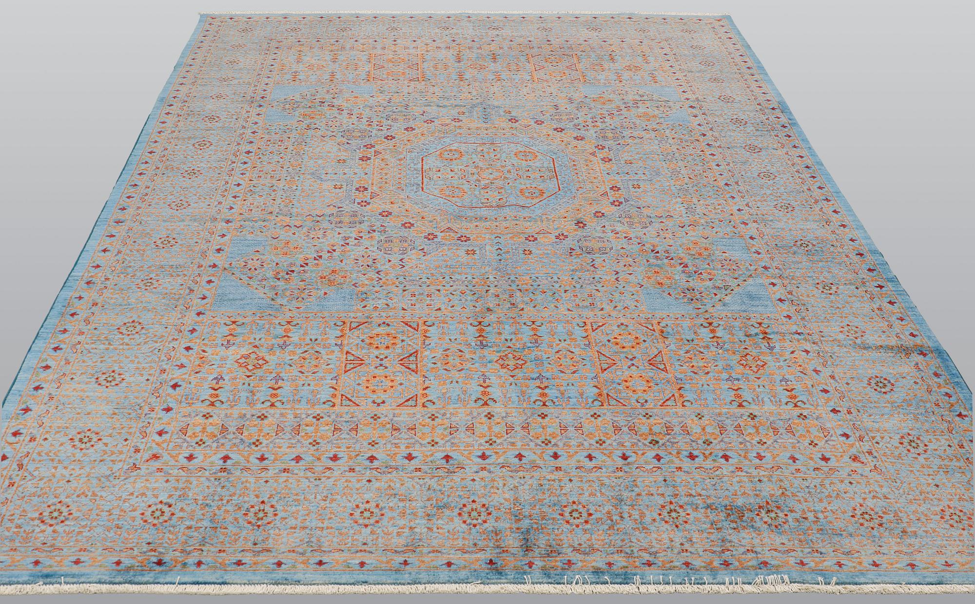 An oriental carpet with a Mamluk pattern, ca 299 x 210 cm.