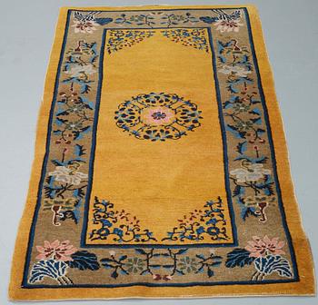 A RUG, an old China, ca 177,5 x 92,5 cm.