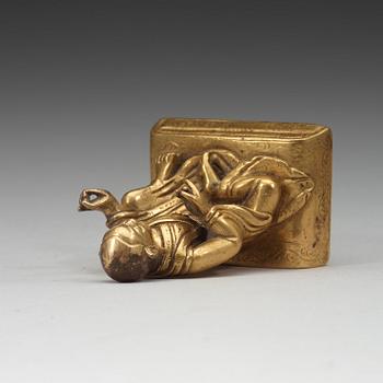 A small gilt-bronze seated Buddhist lama, Tibet, 20th Century.