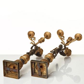 A pair of French Empire early 19th century four-light candelabra.