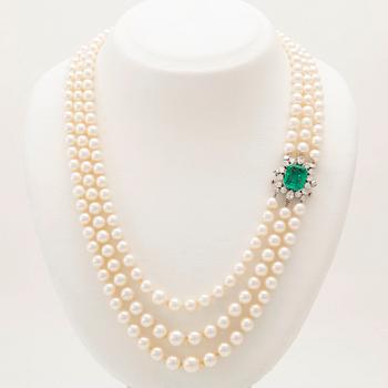 W.A. Bolin, a cultured pearl necklace with an 18K white gold clasp set with an emerald and diamonds, Stockholm 1960.