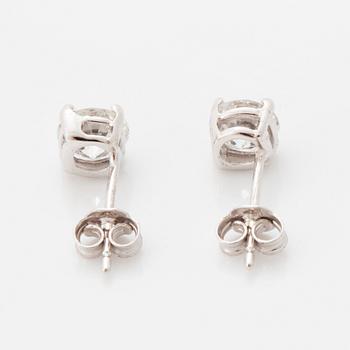 Brilliant-cut diamond stud earrings.