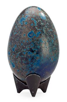 A Hans Hedberg faience egg on an iron base, Biot, France.