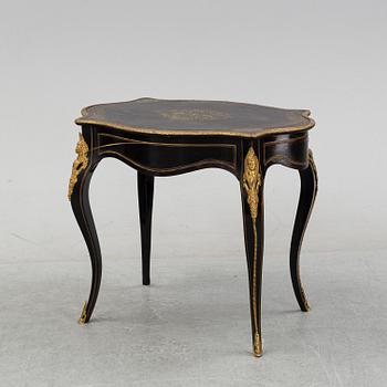 A Louis XV style table, early 20th Century.