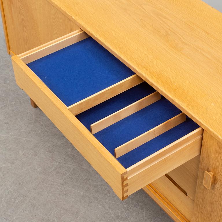 A second half of the 20th century oak veneered 'Arild' sideboard by Nils Jonsson, Troeds, Sweden.