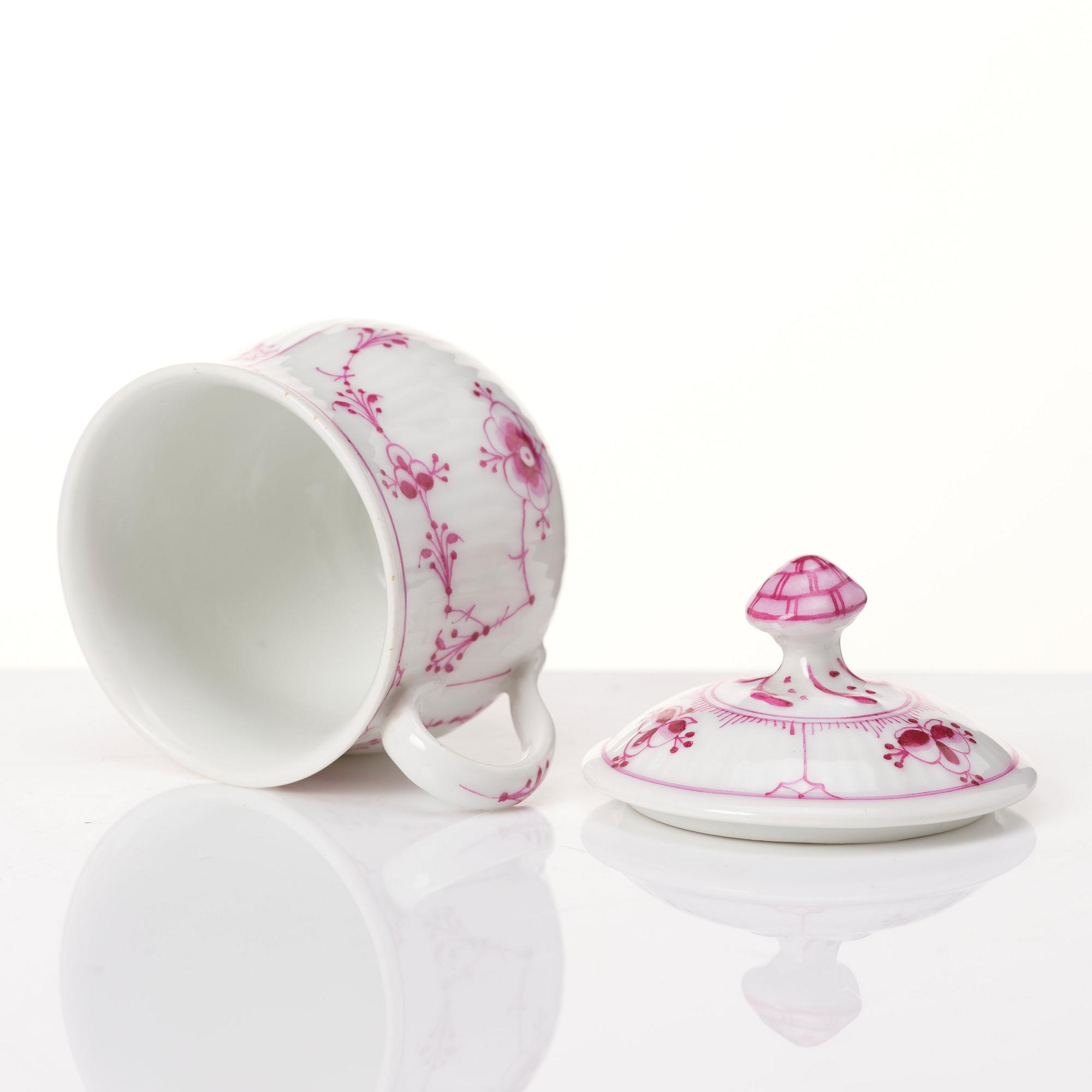 A set of 12 Royal Copenhagen Ruby Red Musselmaalet custard cups with a tray, Denmark, circa 1900-1923.