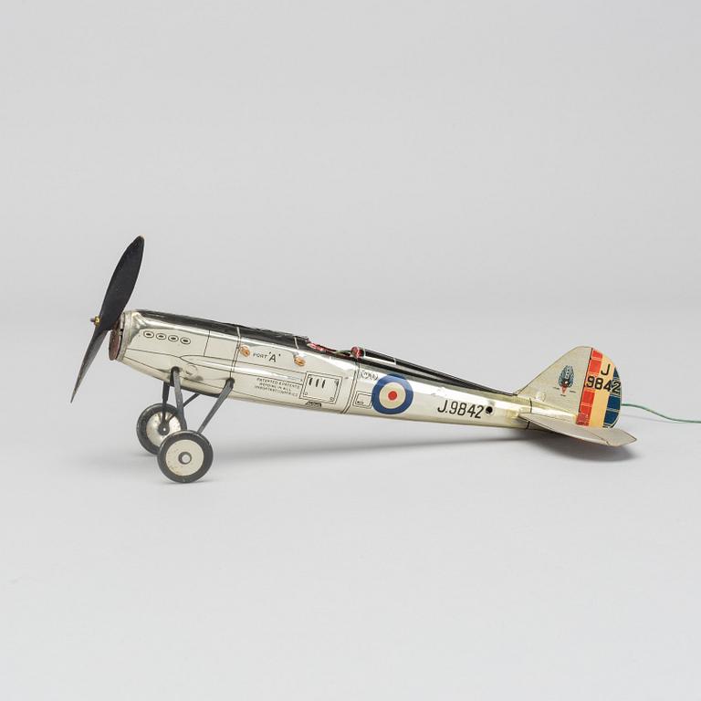 A COLLECTION OF MECHANICAL TIN TOYS, ONE  Frog Interceptor Fighter  Mark IV" England 1930'S.