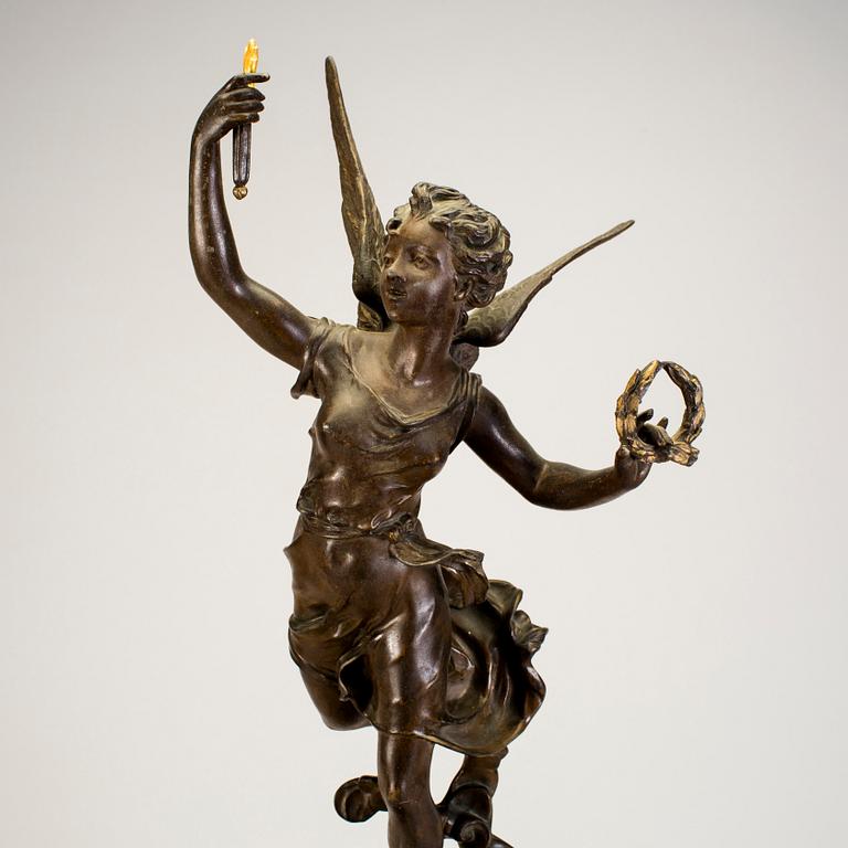 A mantel clock with sculpture "L'occident" after Émile Bruchon from the turn of the century 1800/1900.