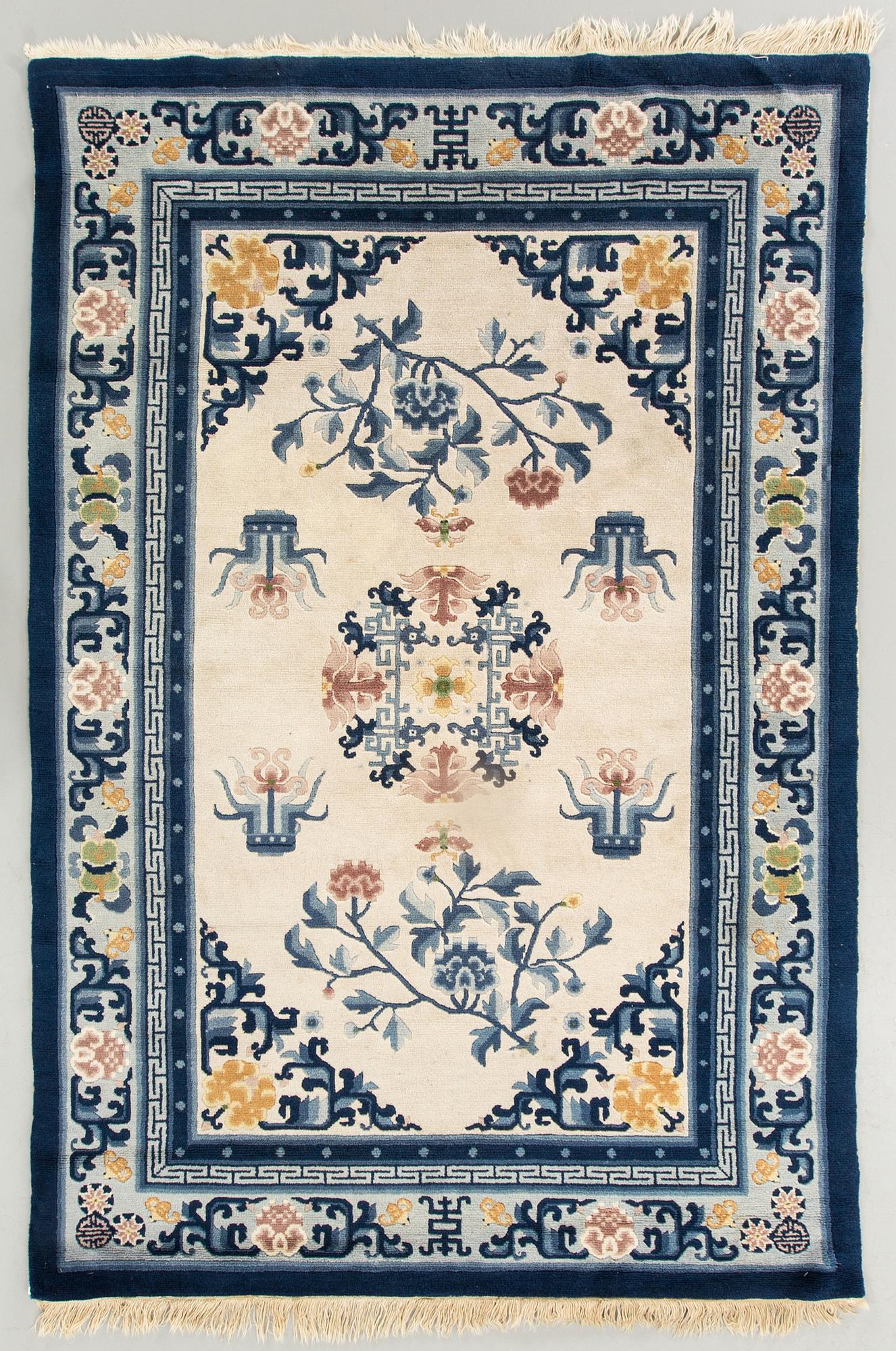 An old Chinese carpet ca 187 x 127 cm.