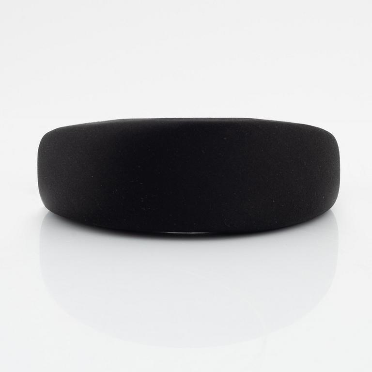 Prada, a black silk hair accessory.