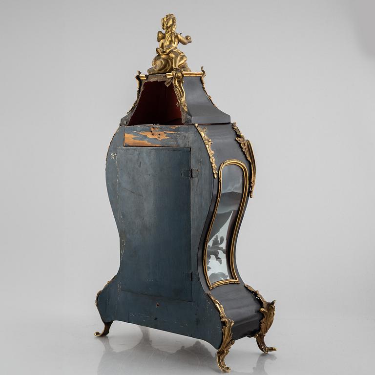Clock, Rococo style with partially older parts, around the year 1900.