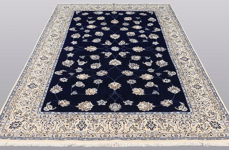 A carpet, Nain part silk s.k 9LAA, ca 312 x 199 cm.